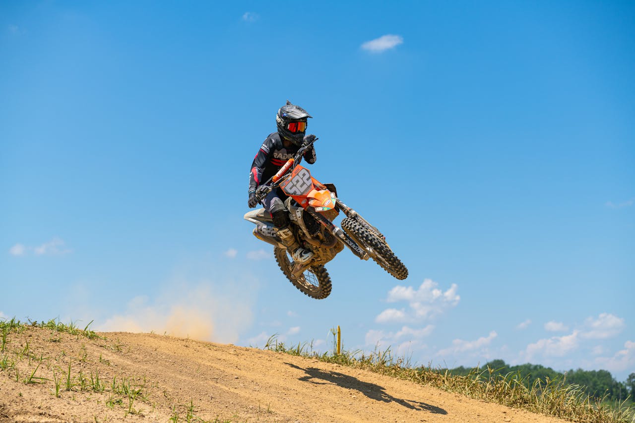 The Art of Drawing Readers In: Your attractive post title goes here Dynamic shot of a motocross rider in mid-air during a jump on a dirt track in Cecil-Bishop, PA.